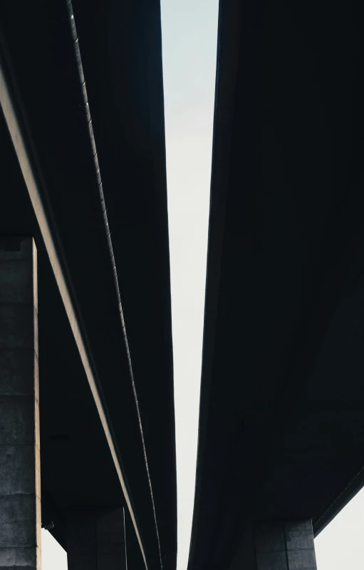 an extreme closeup view from underneath the underside of a bridge