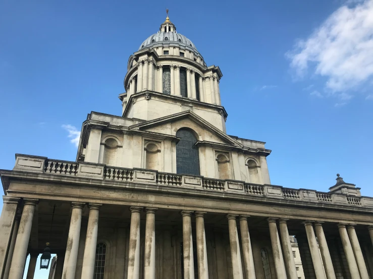 an old cathedral is surrounded by pillars and windows