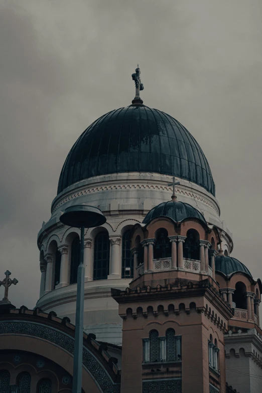 an image of a church with a cross on the roof