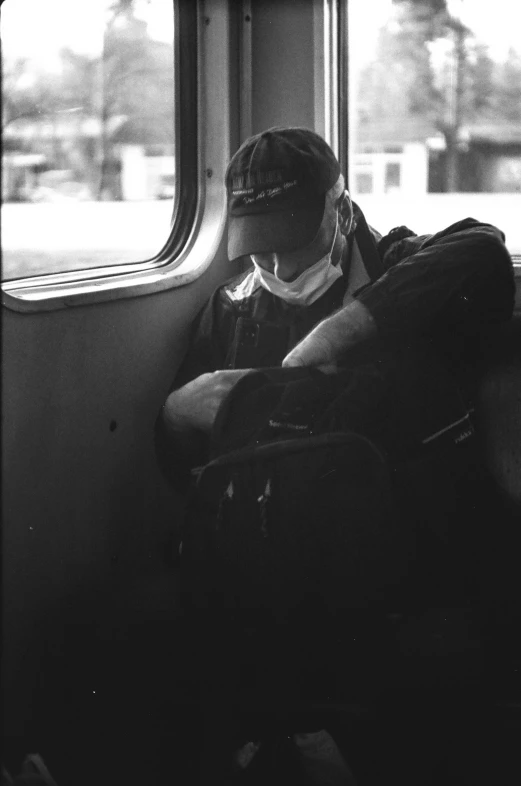 a man is sitting on the passenger train