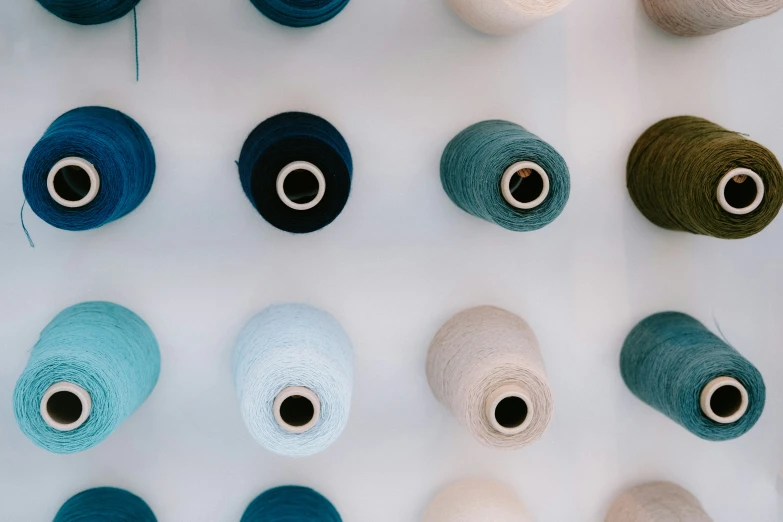 colorful ball of yarn lined up on table