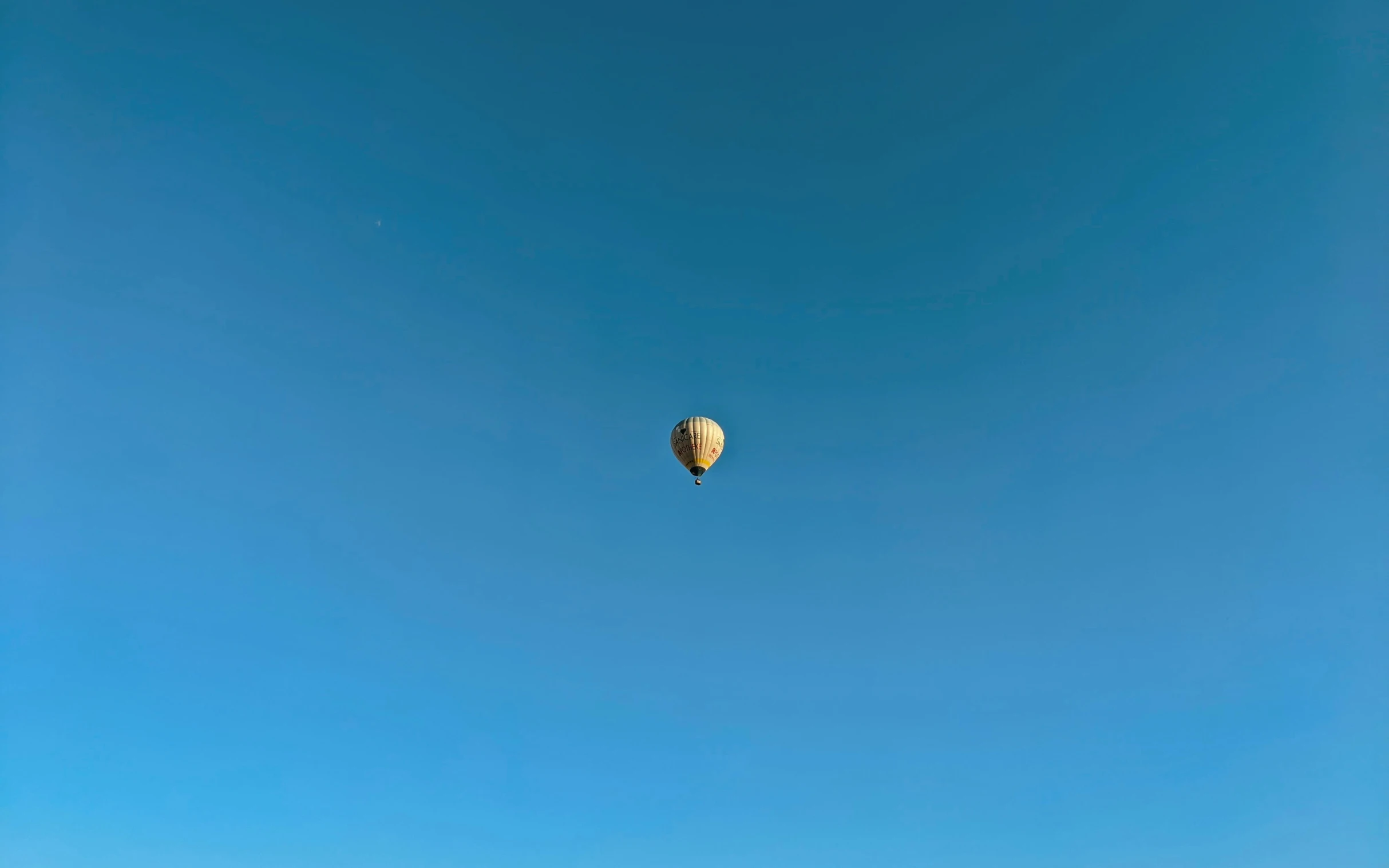 a  air balloon floating in the blue sky