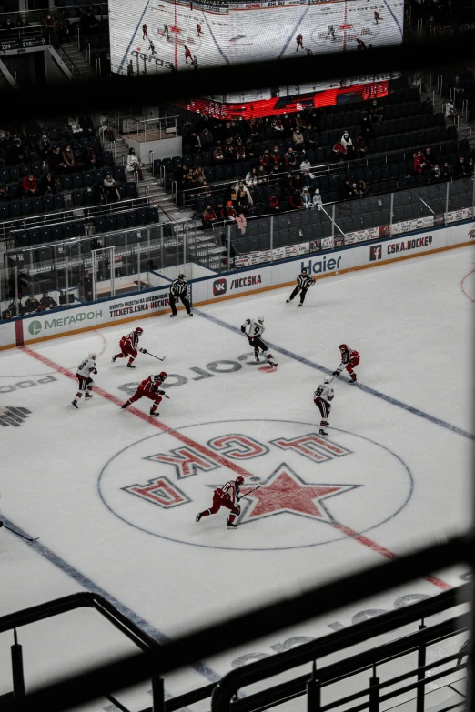 ice hockey game taking place on the hockey rink