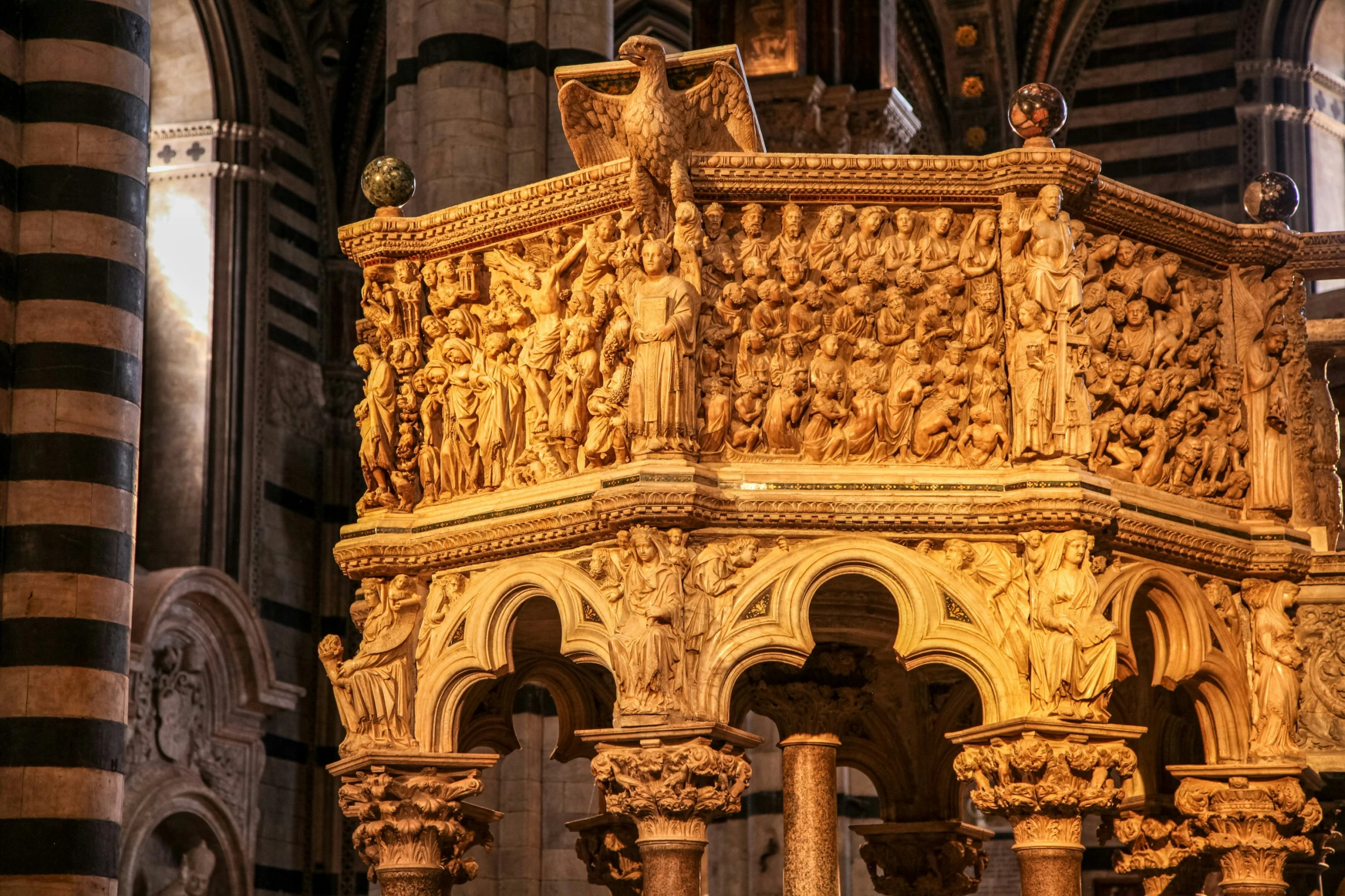 this cathedral has ornate carvings and arches on the front