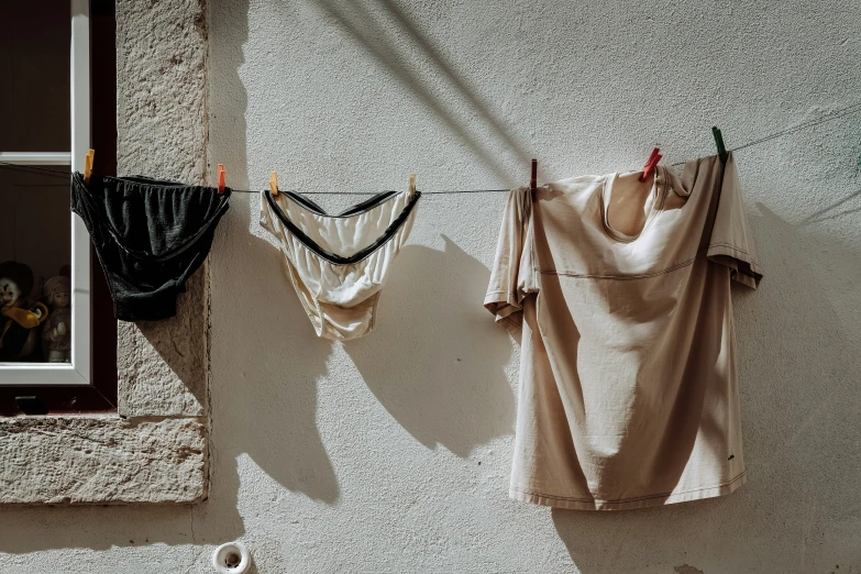 two clothes hung next to each other on a line