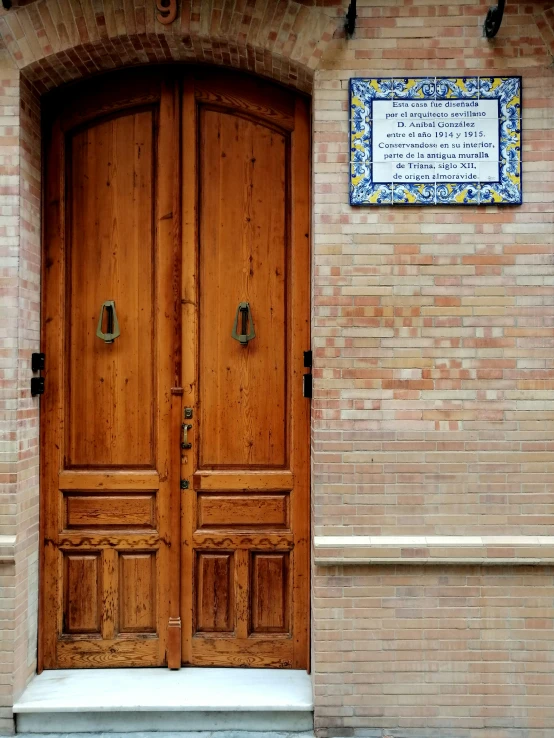 a very nice building with two big wooden doors