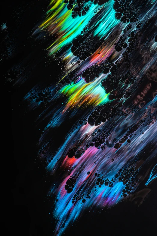 an image of a colorful background with black and multicolored paint streaks