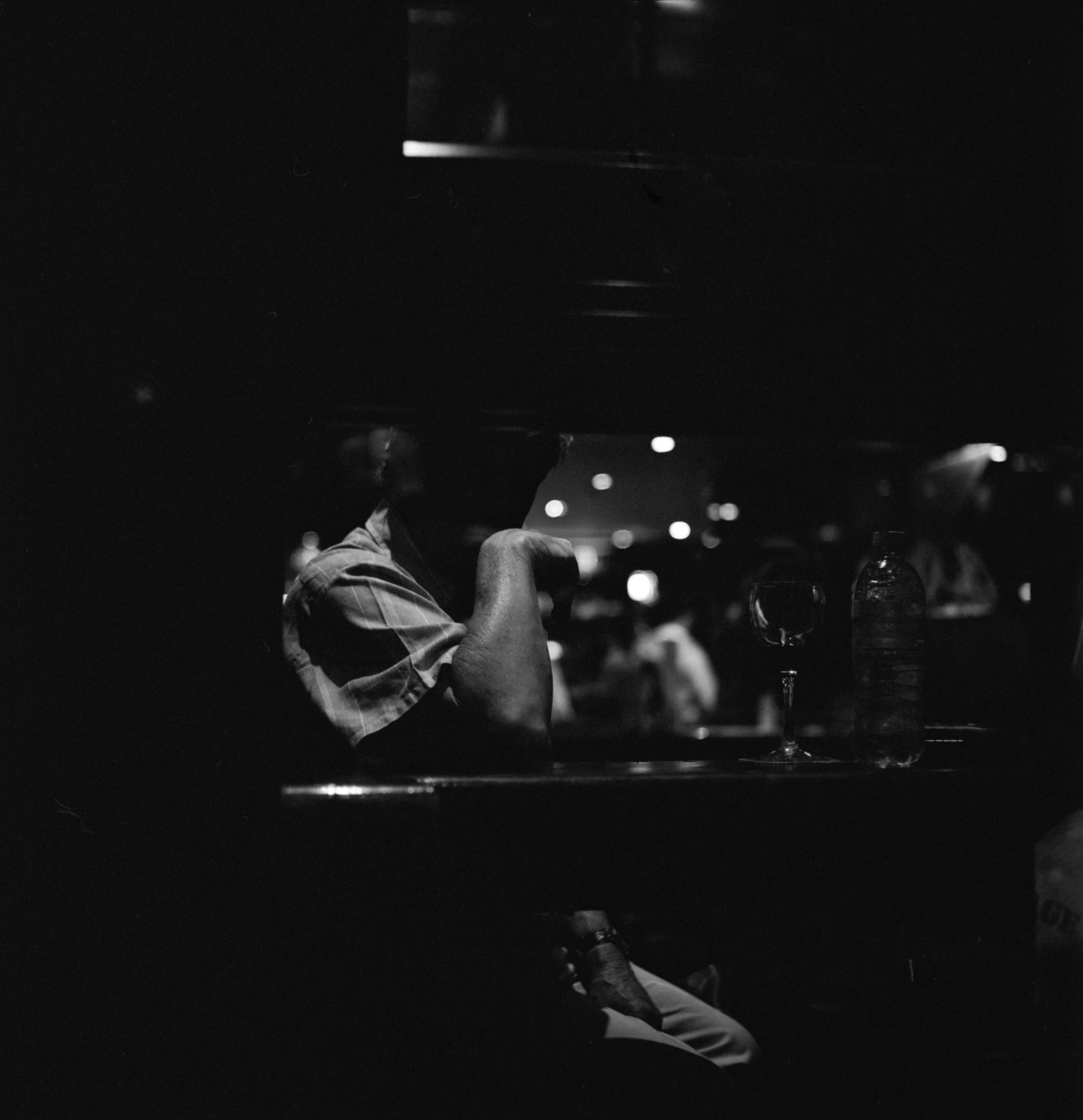 a po in black and white of people at a restaurant