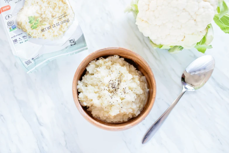 there is rice that is in a bowl on the table