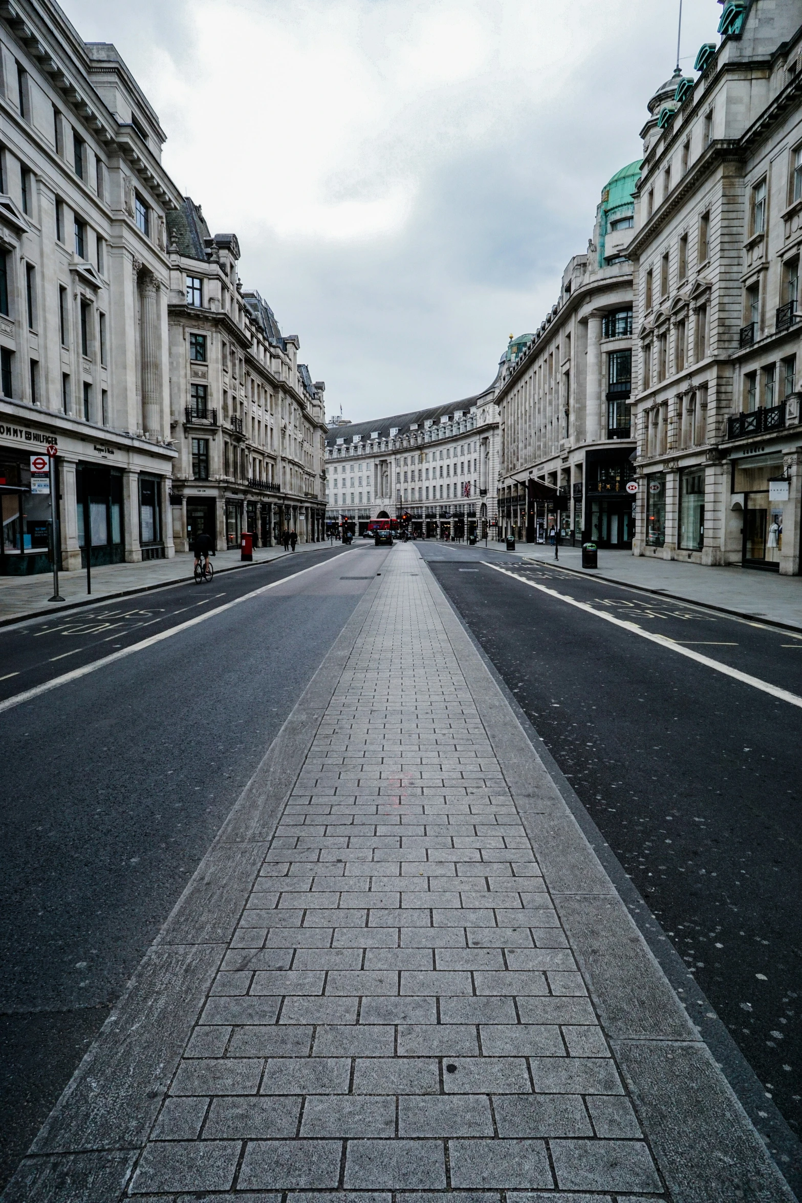 empty street with stone sidewalks in a european city