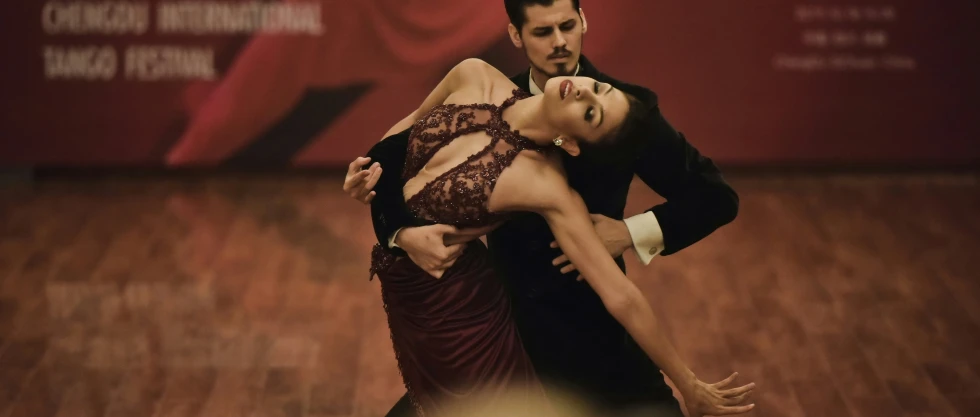 a man and woman are doing an aerial dance