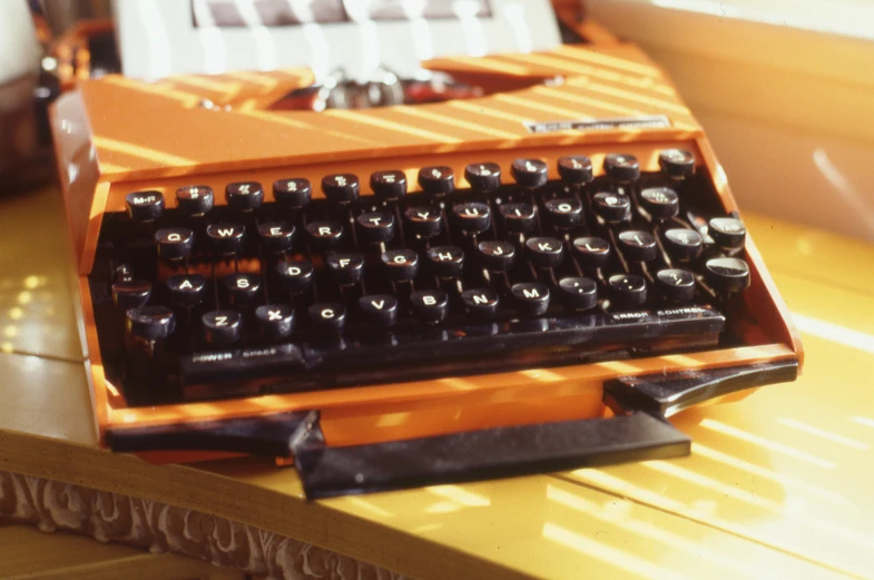 an old fashioned computer sitting on top of a wooden table