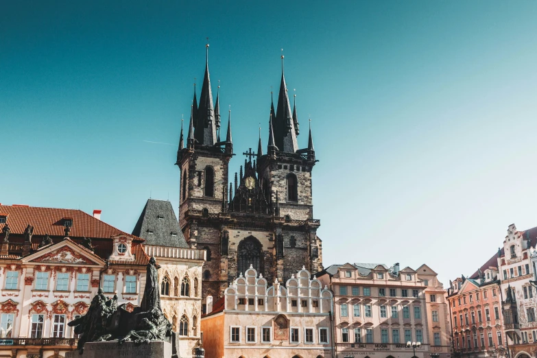 an old style cathedral and some smaller buildings