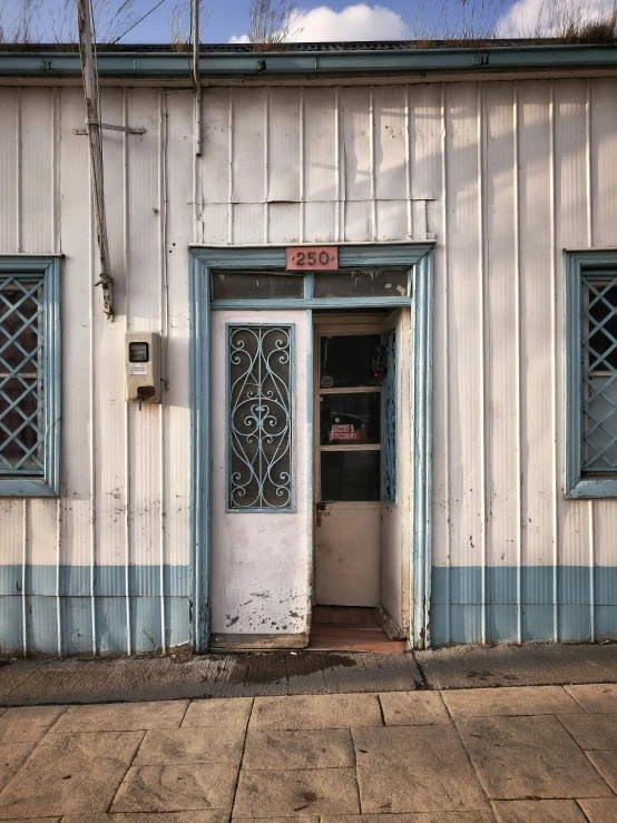 a door and window on the front of an old building