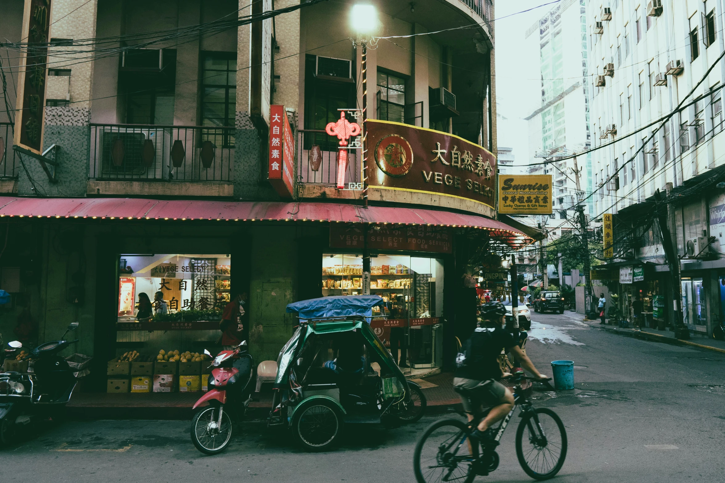 people on bikes parked outside a bar on a side walk