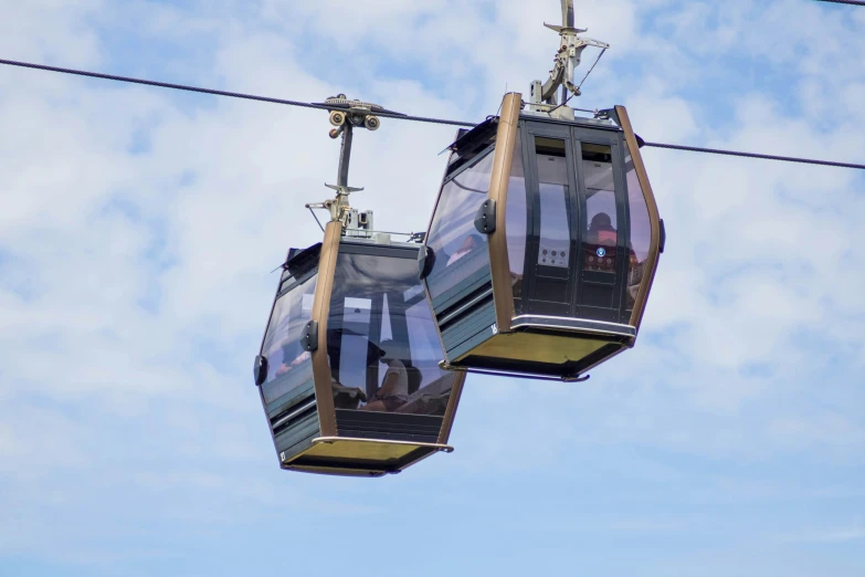 two gondolas with a man walking down the side