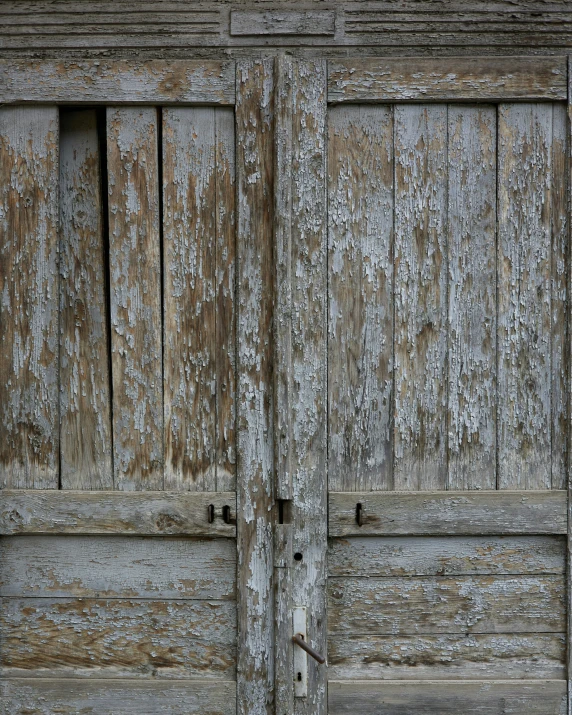 two old wooden doors made of wooden planks