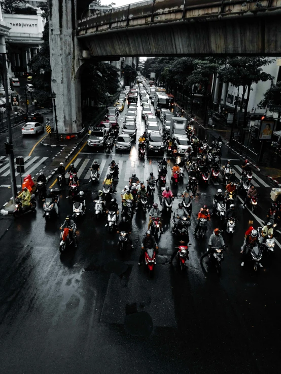 a city street filled with lots of motor bikes