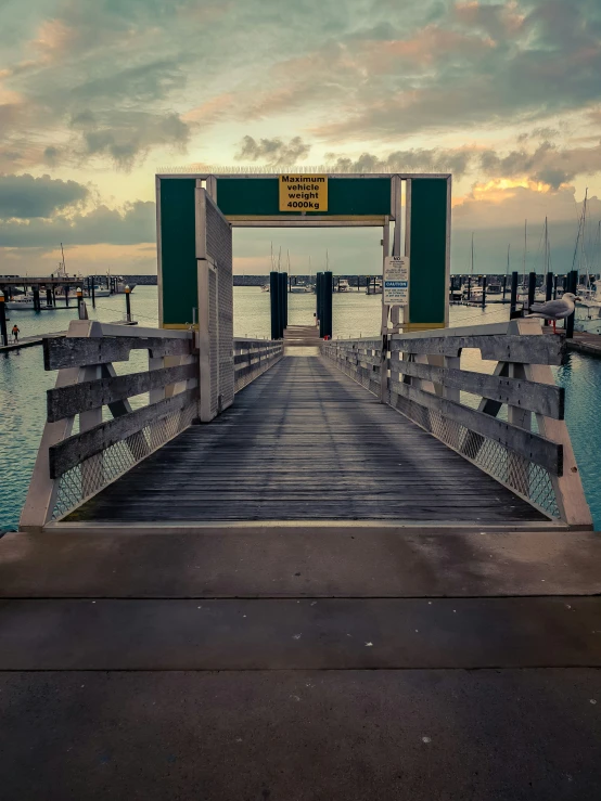 the dock is empty with boats on it