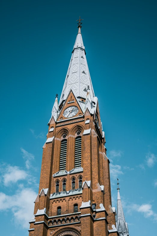 the old cathedral is made up of brick and has white roof