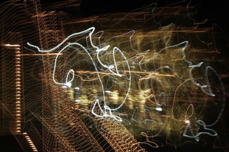 a long exposure po of lights above a fence