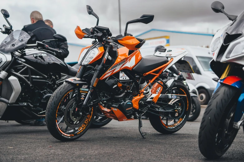 three motorcycles parked near each other on the road