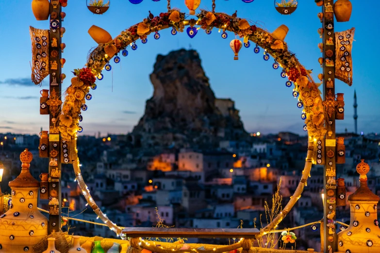 an elaborate arch sits in the middle of a large city