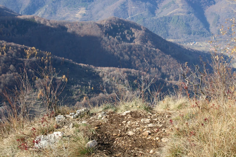 a view of some mountains with brown vegetation