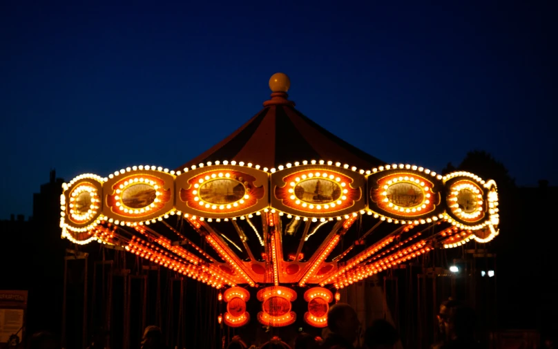 the merry go round at night in an amut park