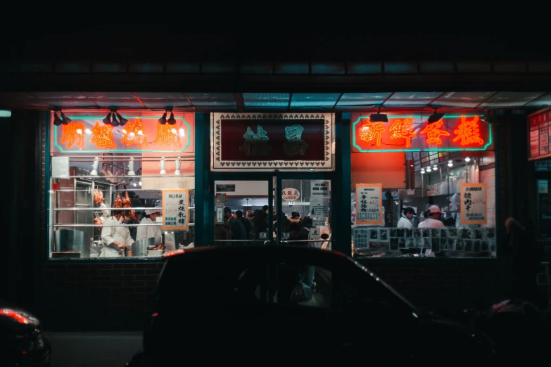 an asian restaurant with several lit up windows