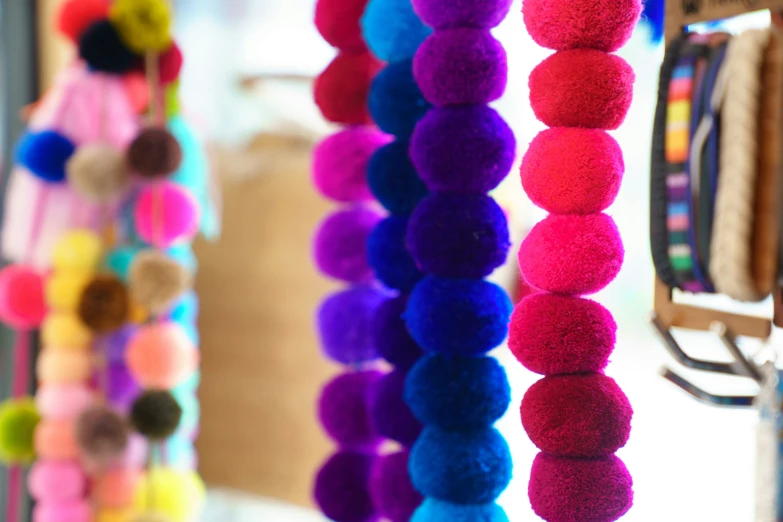 close up of colorful pompom hanging in room