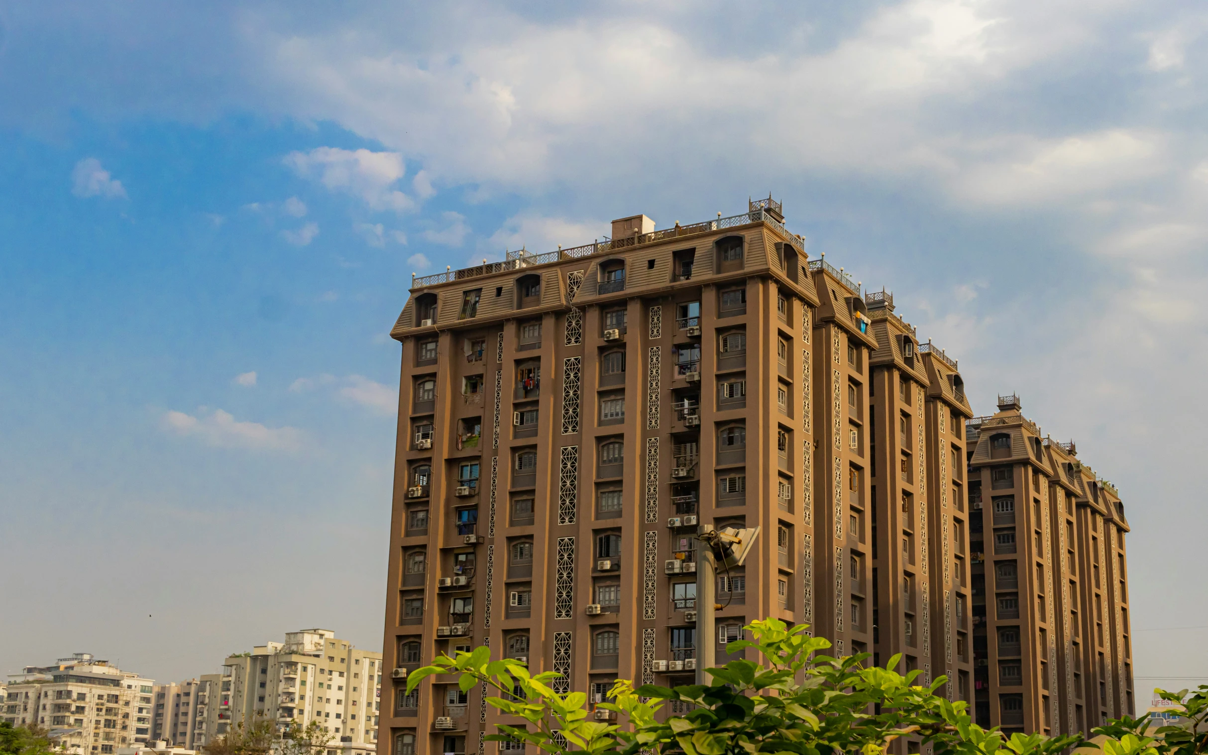 the building is made of three levels and has large balconies on top