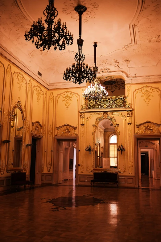 large hallway with chandelier and ornate wall covering