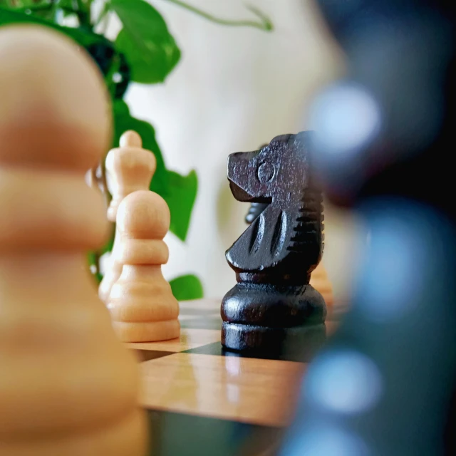 a pawn and chess piece on a table