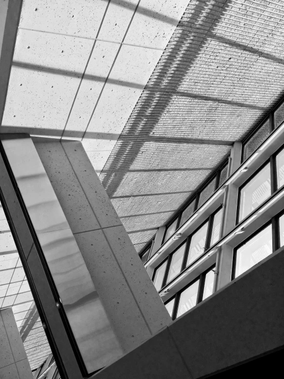 a person standing underneath an umbrella on a stairway