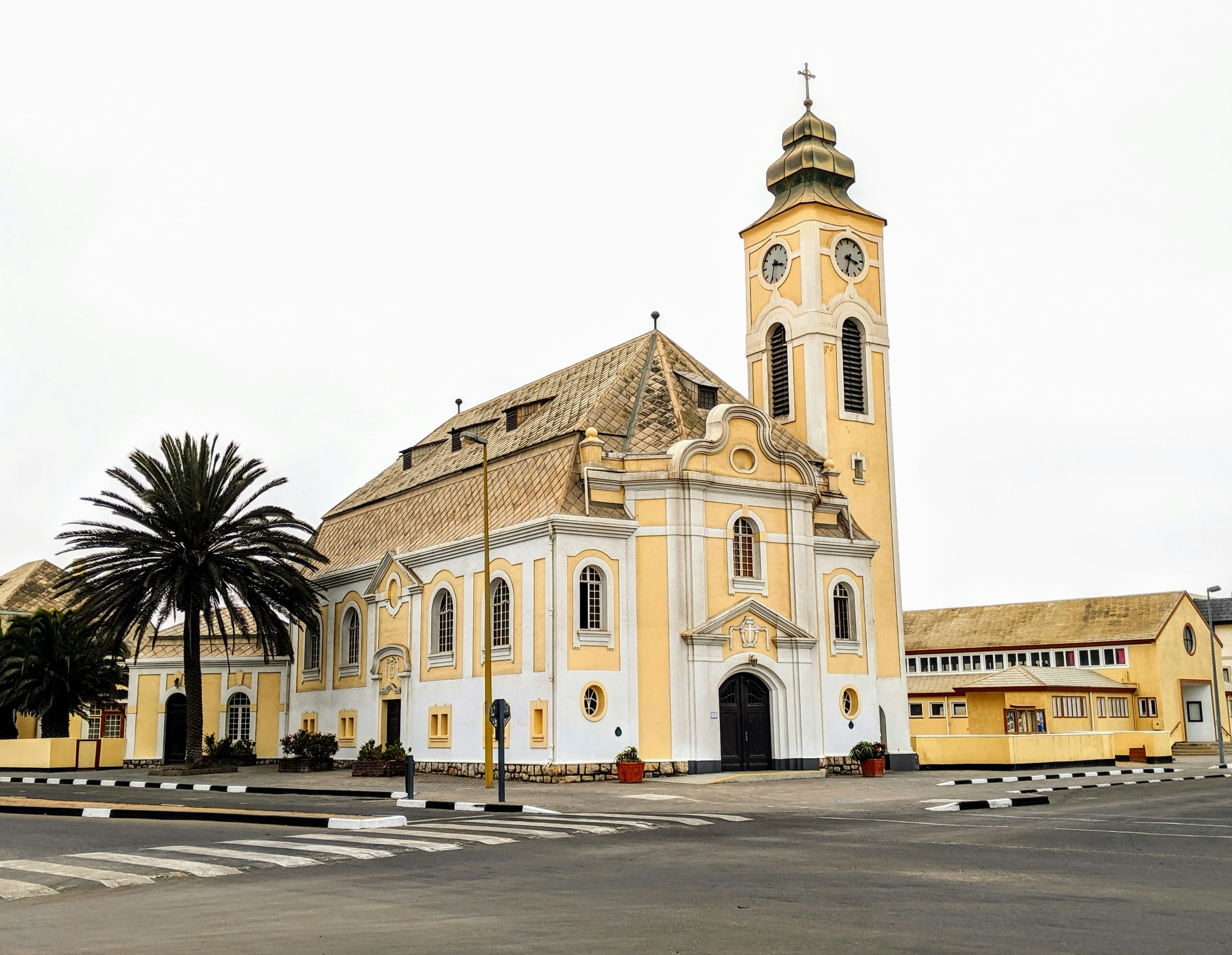 an old yellow building on the corner of a street