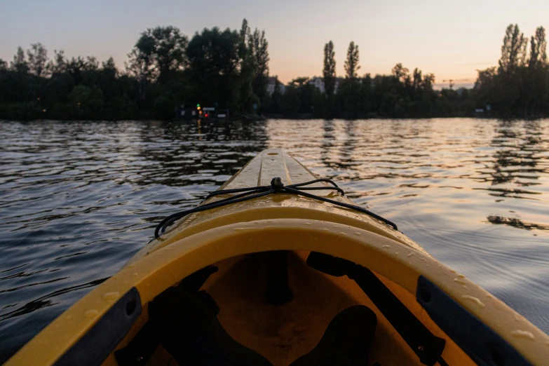 a person riding in a canoe on the water