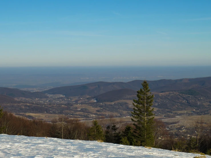 two snowboarders on top of a ski slope