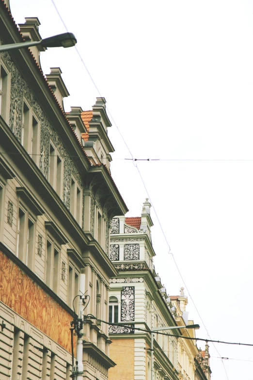 a few tall buildings with many windows along a city street