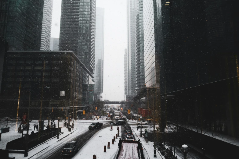 a busy street filled with lots of traffic and surrounded by tall buildings