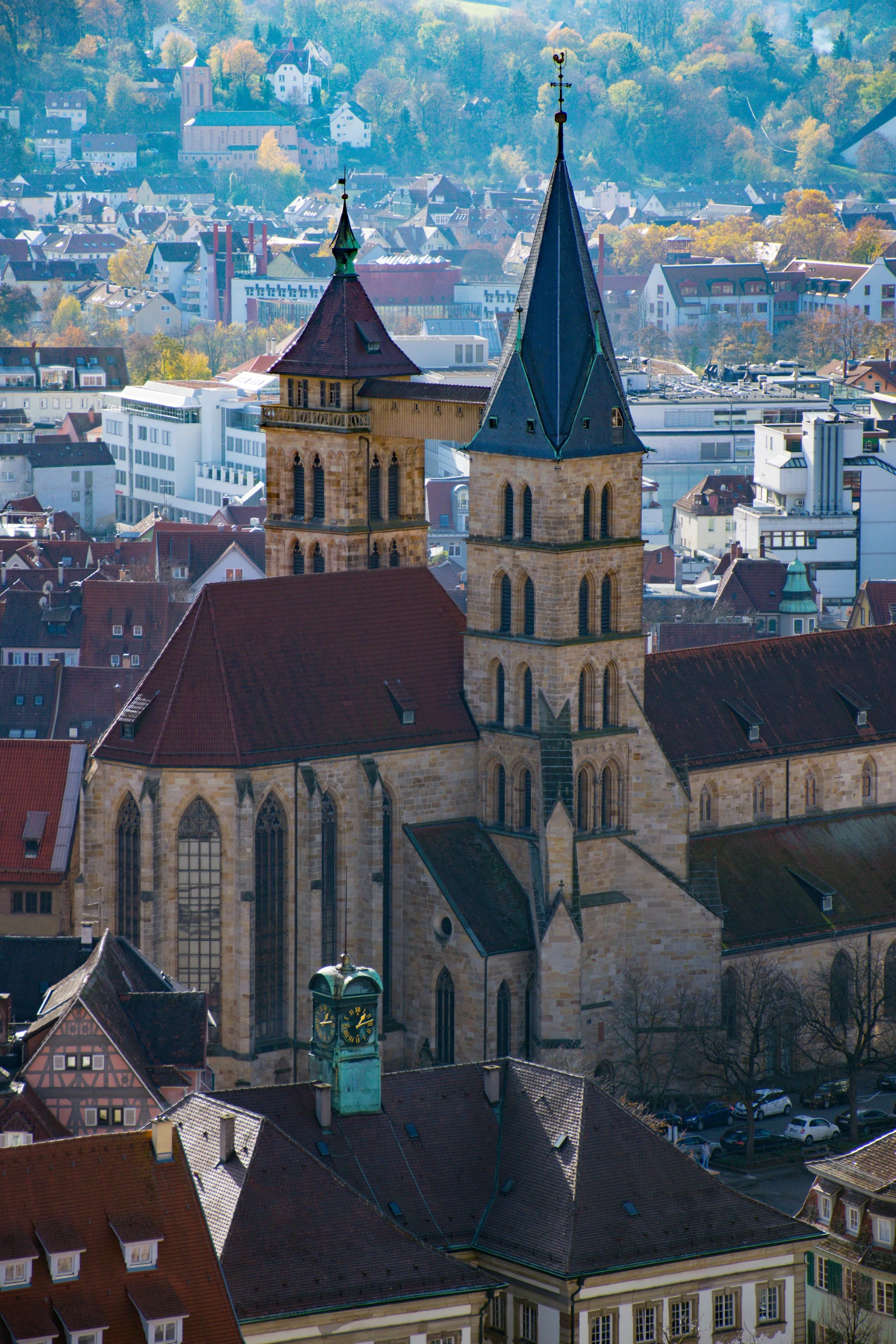 some buildings with roofs and a mountain in the background