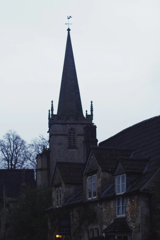 there is a old church building with a steeple