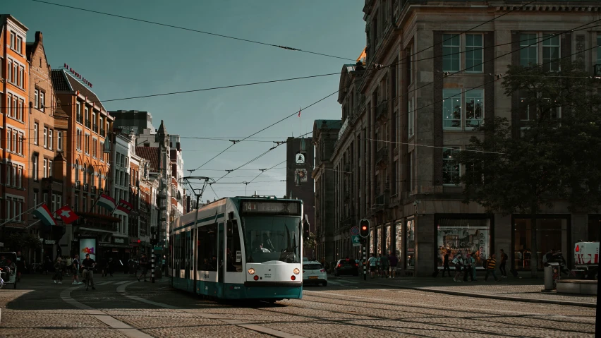 a street trolley rides down a city road