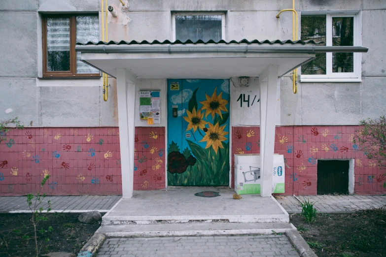 there is graffiti on the door and the walkway