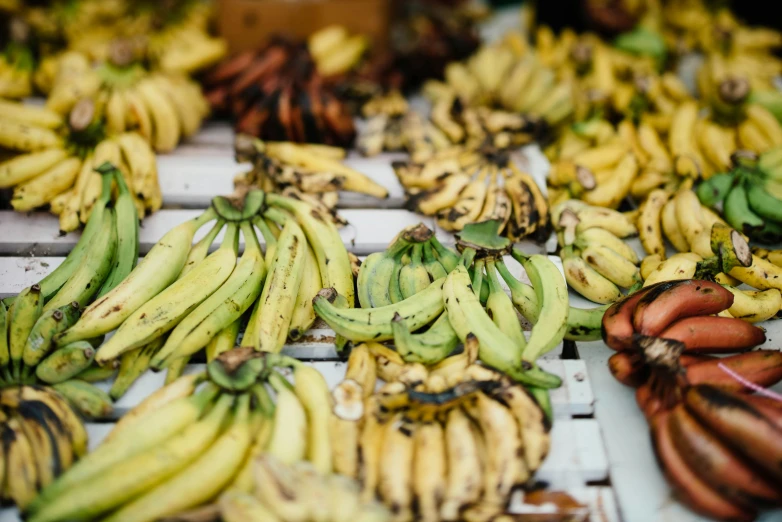 a bunch of ripe yellow and green bananas