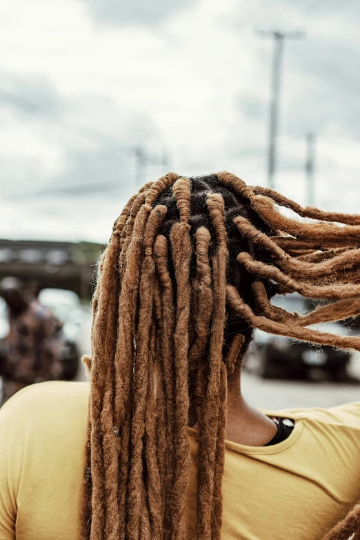 a woman with some dreadlocks on her head