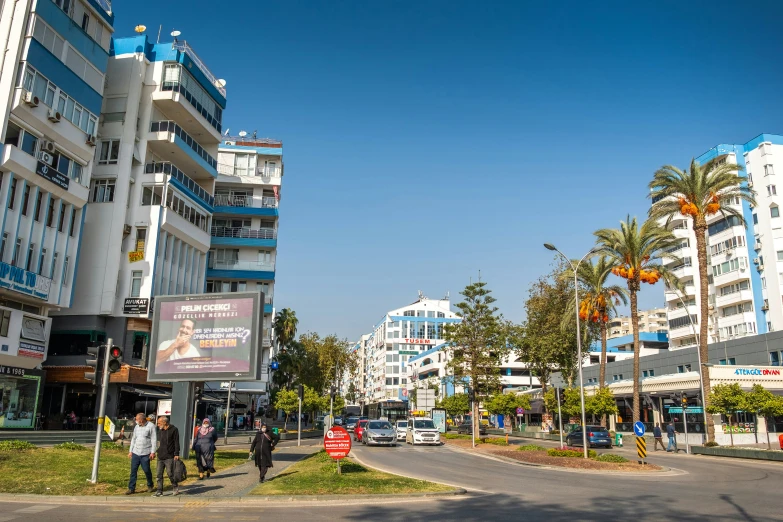 the people are waiting to cross the street