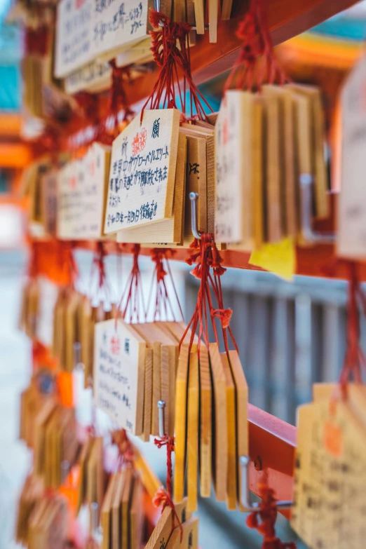 the oriental style prayer wheel hanging from a pole