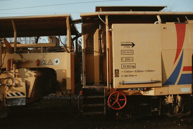 an old train engine is parked next to a building