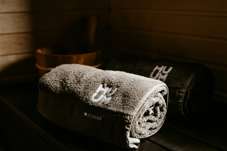 an old towel is on top of the wooden bench